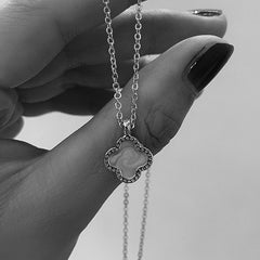 Stylish four-leaf clover necklace shown on a model