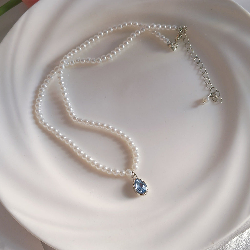 Handcrafted blue pearl necklace with details