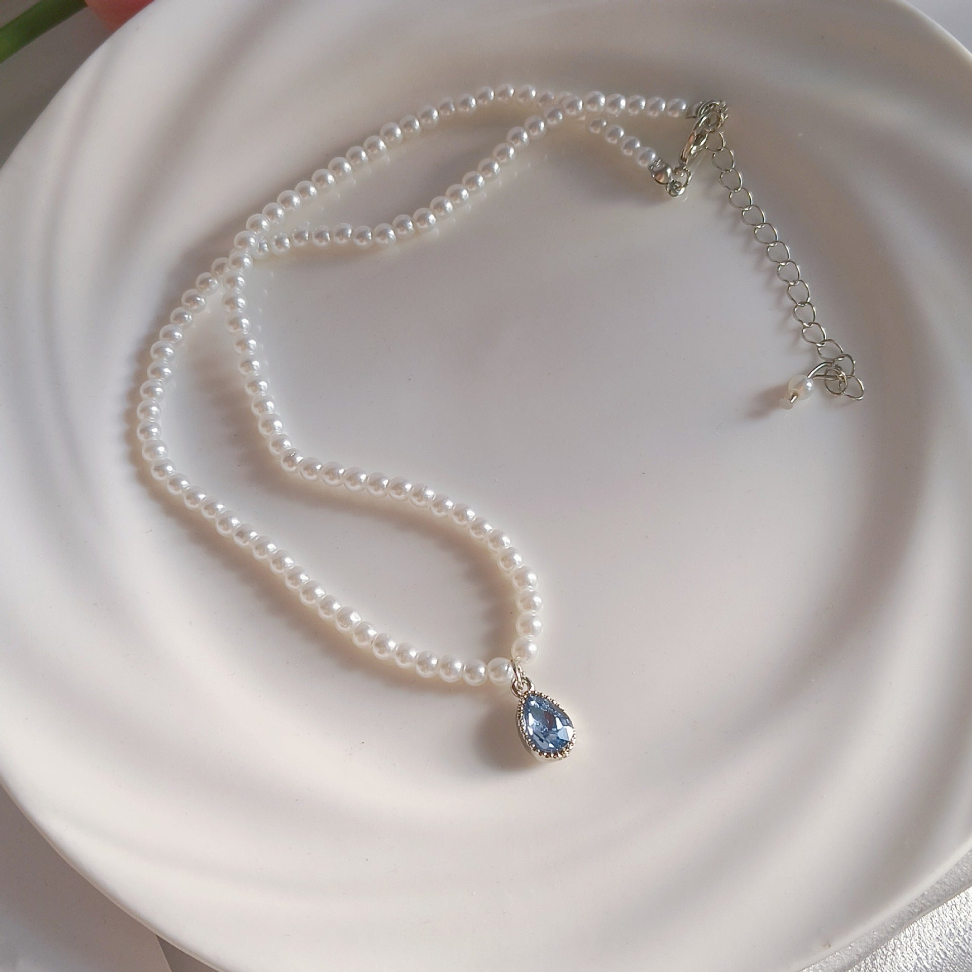 Handcrafted blue pearl necklace with details