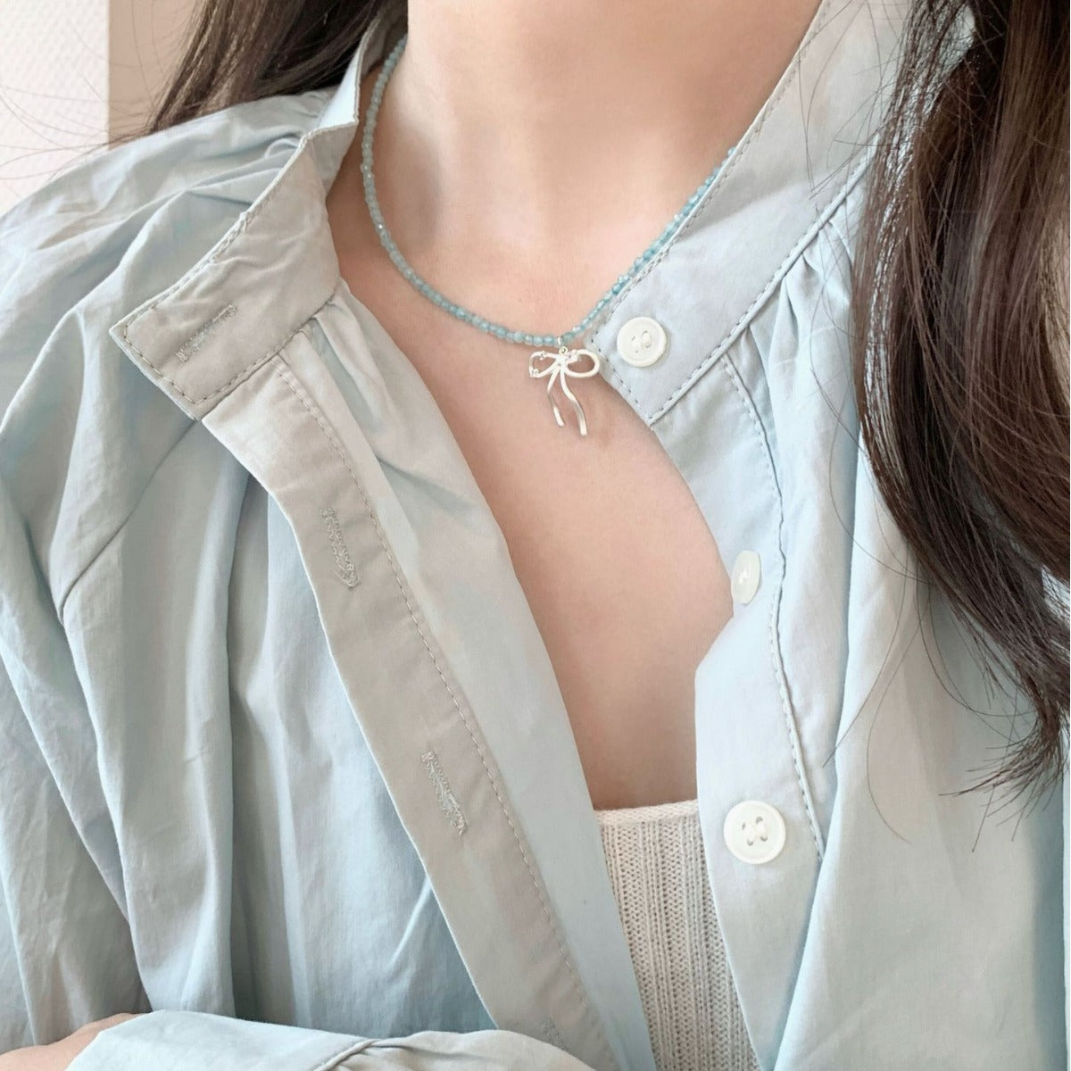 Beautiful water blue bowknot necklace from different angles