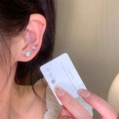 close-up of zircon stud earrings