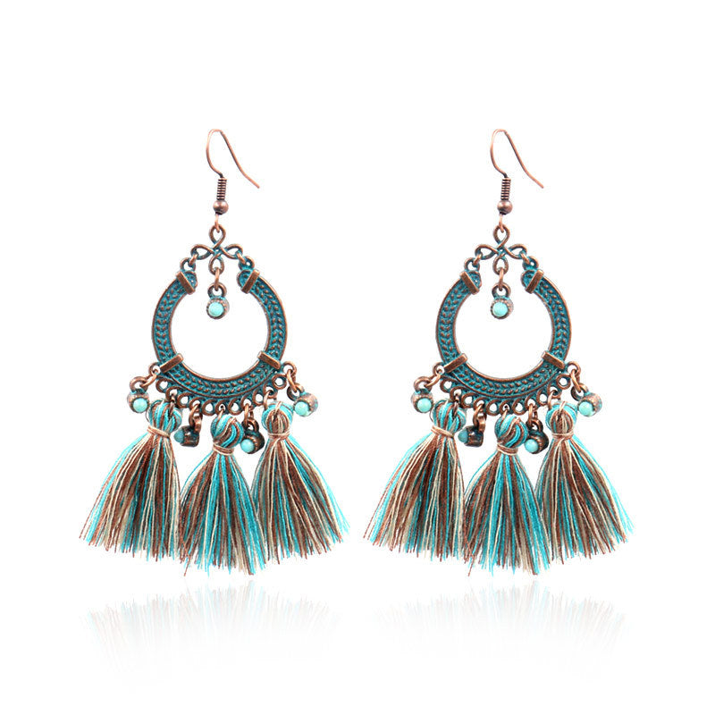 close-up of tassel earrings highlighting details