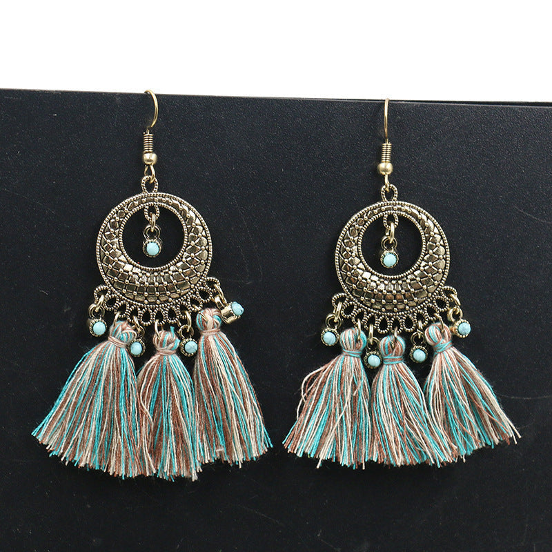 pair of chic Bohemian earrings on display
