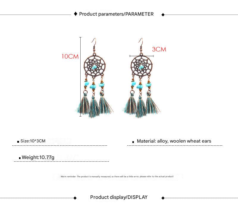 stylish earrings placed on a soft fabric background