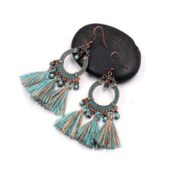 close-up of tassel earrings highlighting details