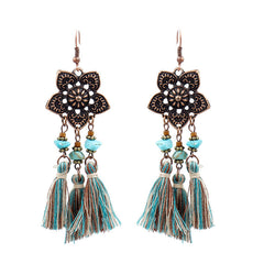 showcasing the lightweight design of tassel earrings