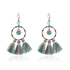 pair of chic Bohemian earrings on display