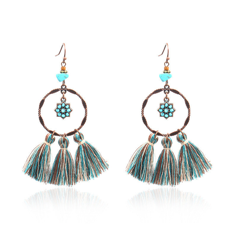 pair of chic Bohemian earrings on display