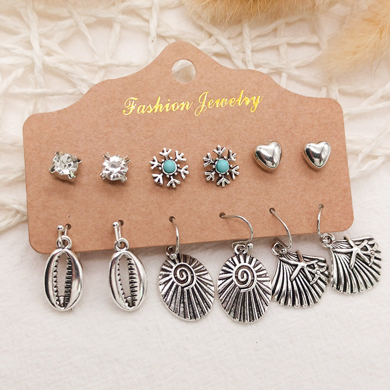 Close up of Leaf and Feather Dangle Earrings design