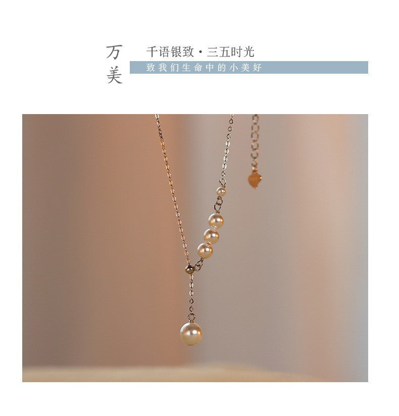Detailed image of tassel design on silver necklace
