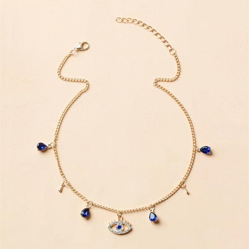 Gold-Plated Crystal Evil Eye Necklace flat lay