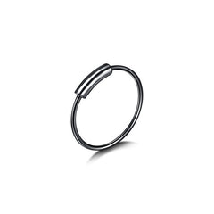 Close-up view of stylish nose ring and earrings set in stainless steel
