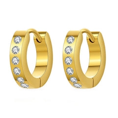Artistic photo of geometric earrings with zircon stones