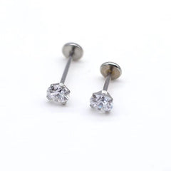 Close-up of geometric lip piercings in stainless steel image 2
