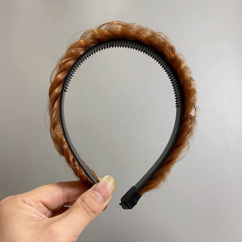 Durable plastic hairband displayed with floral backdrop