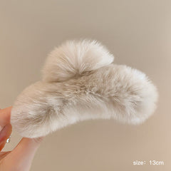 Cozy hair accessory featuring plush rabbit fur