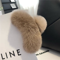Trendy gray rabbit fur hair clip on displayed model