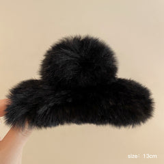 Lifestyle image showcasing rabbit fur hair clip in use