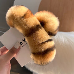 Close-up of stylish claw clip for hair with rabbit fur
