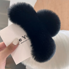 Lifestyle image showcasing rabbit fur hair clip in use