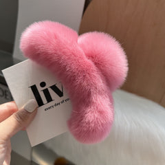 Close-up of stylish claw clip for hair with rabbit fur