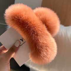 Lifestyle image showcasing rabbit fur hair clip in use
