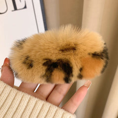Trendy gray rabbit fur hair clip on displayed model