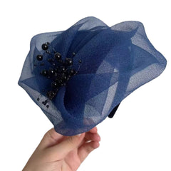 Stylish breathable half hat in brown on table