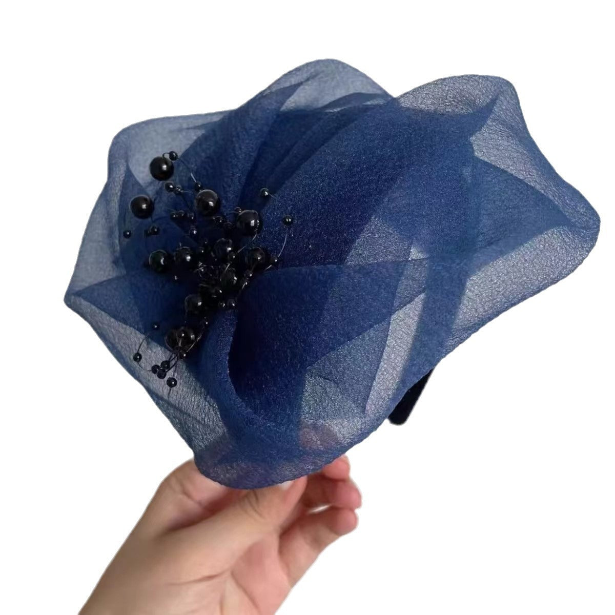 Stylish breathable half hat in brown on table