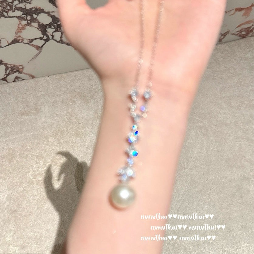 Fashionable butterfly pearl necklace on display