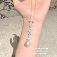 Fashionable butterfly pearl necklace on display