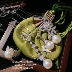 Close-up of butterfly design on gemstone pearl necklace