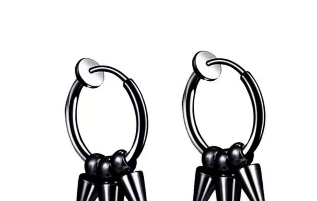 close up of titanium pointed studs earrings