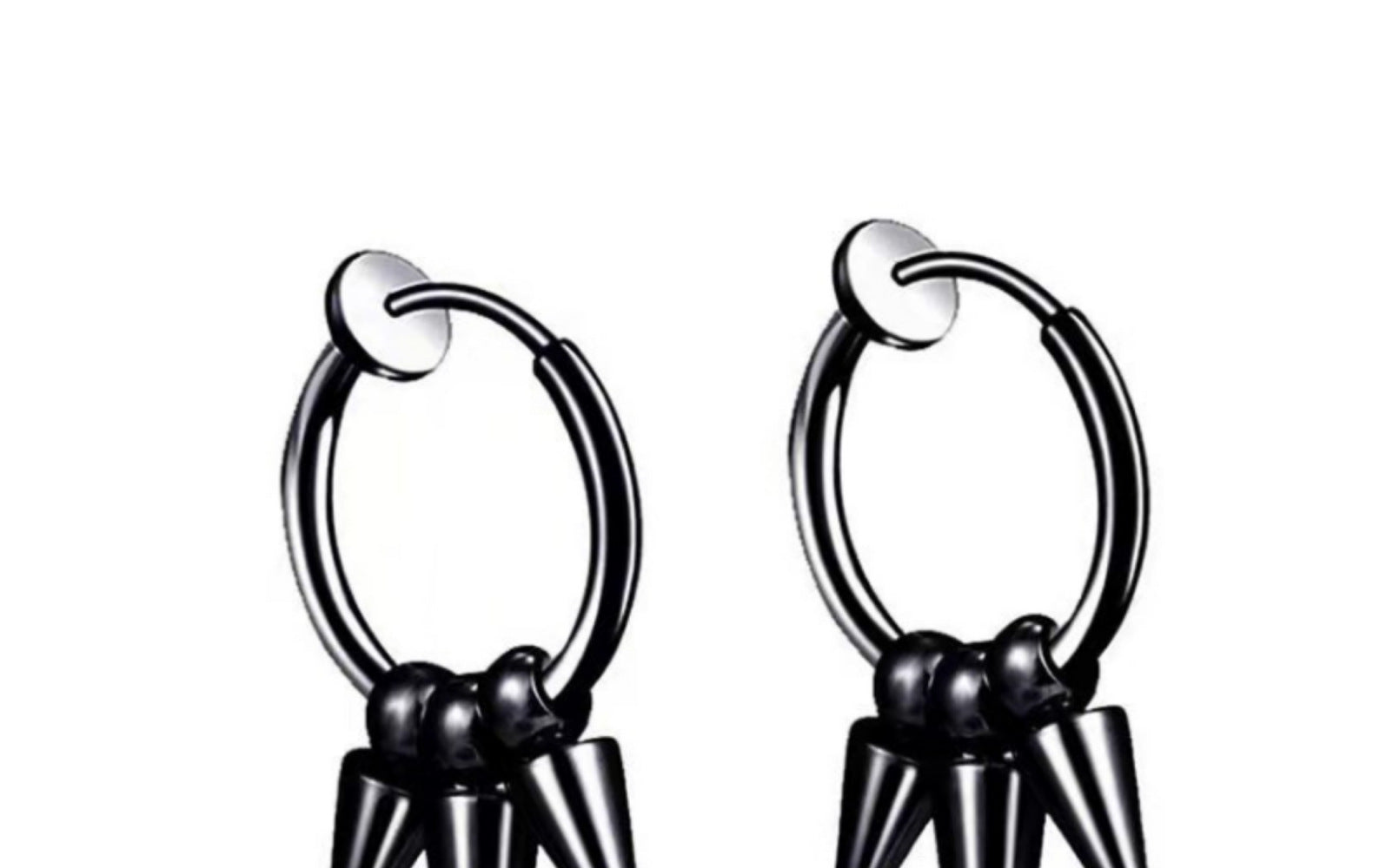 close up of titanium pointed studs earrings