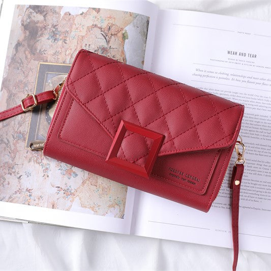 Stylish quilted mini shoulder bag in orange