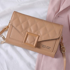 Stylish quilted mini shoulder bag in brown