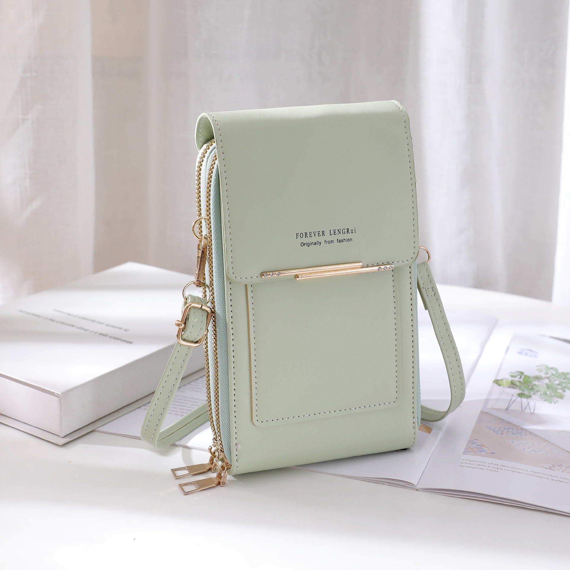 Light blue shoulder bag with zipper closure