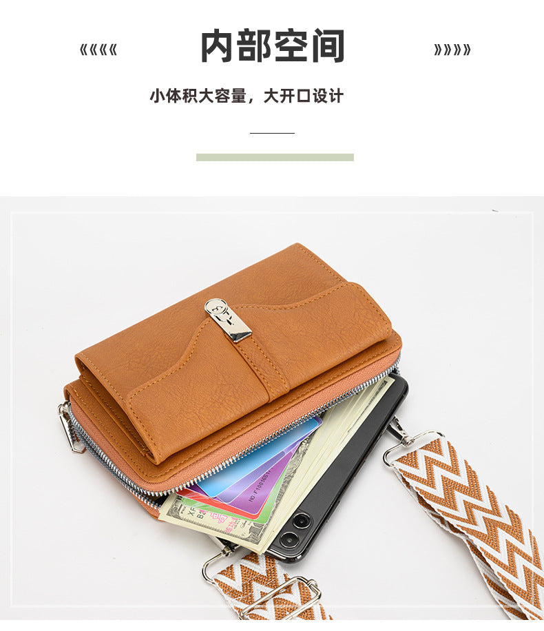 Purple shoulder bag against white background