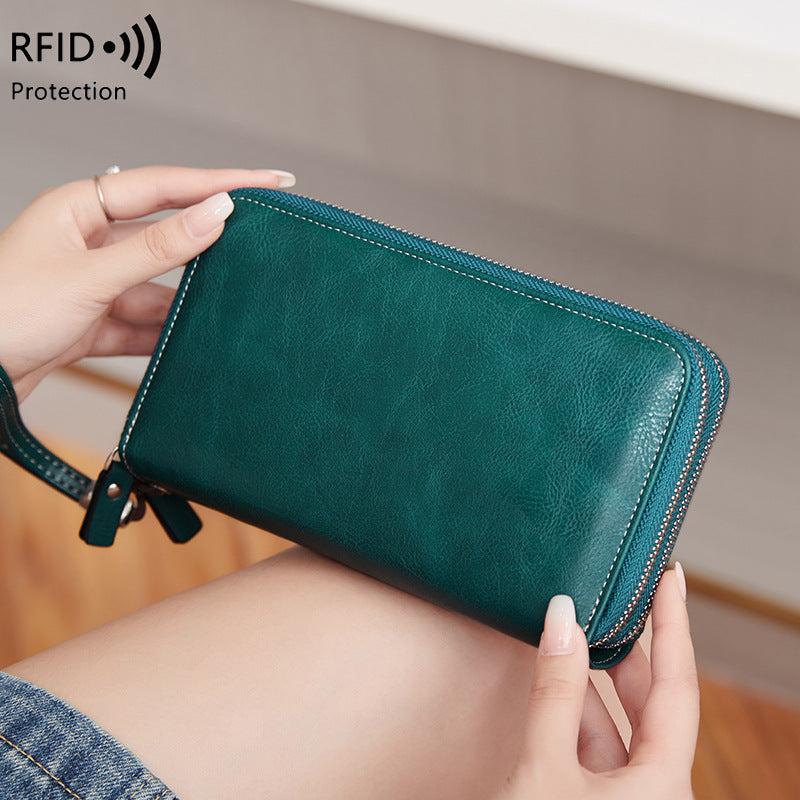 Stylish double-zip clutch wallet in Peacock Blue