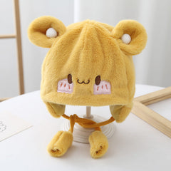 Front view of baby wearing Cozy Plush Hat
