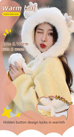 Cute plush hat with antlers and pom poms front view