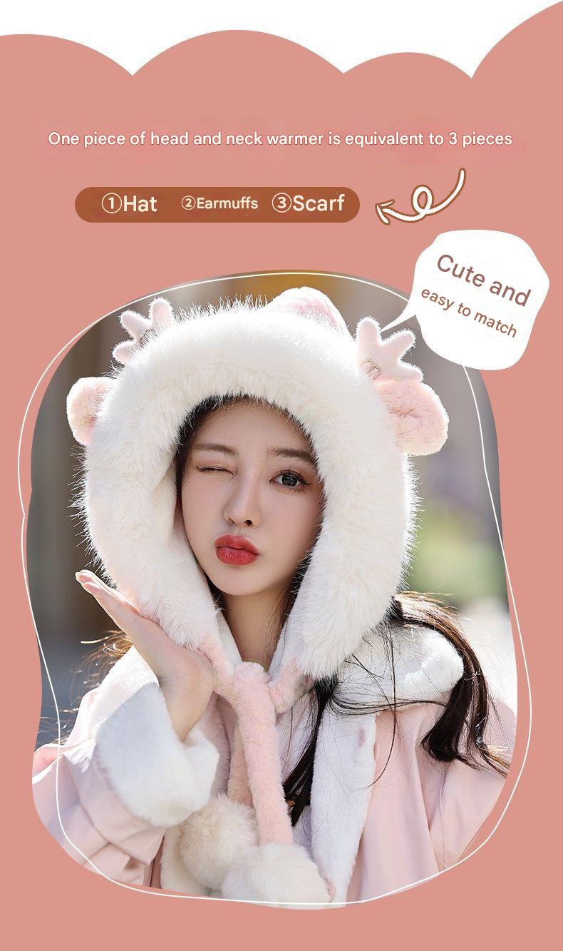 Stylish winter hat with antlers and pom poms side view