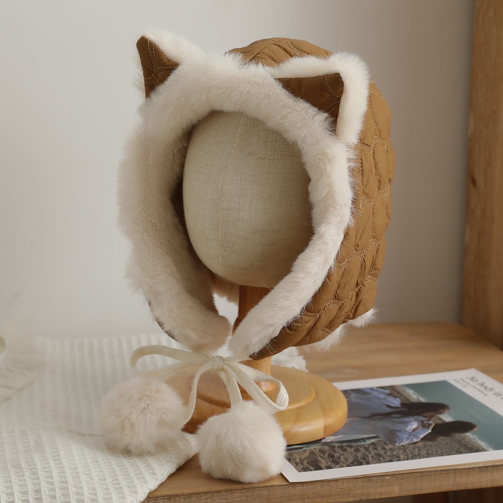Stylish feminine fox ear hat in winter outdoor setting