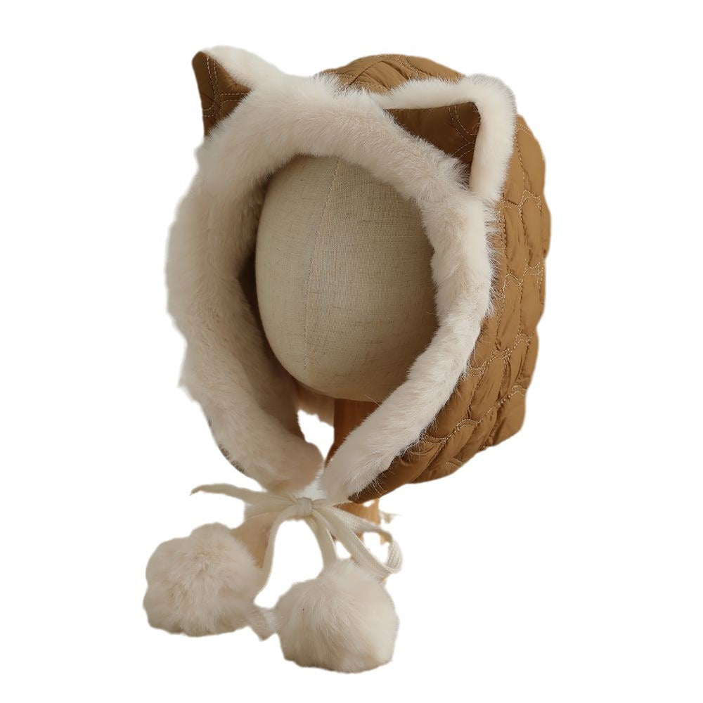 Woman wearing a plush fox ear winter hat outdoors
