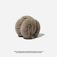 White ear muffs showcased outdoors