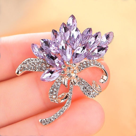 Close-up of intricate rhinestone detailing on brooch