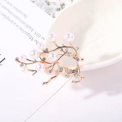 Elegant heart-shaped rhinestone brooch on white background