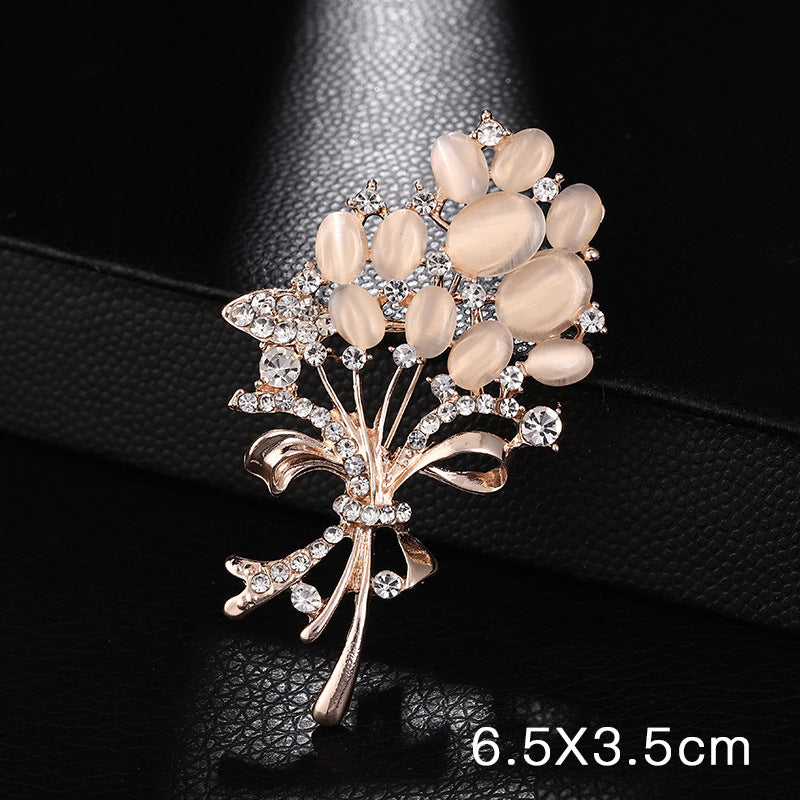 Elegant heart-shaped rhinestone brooch on white background