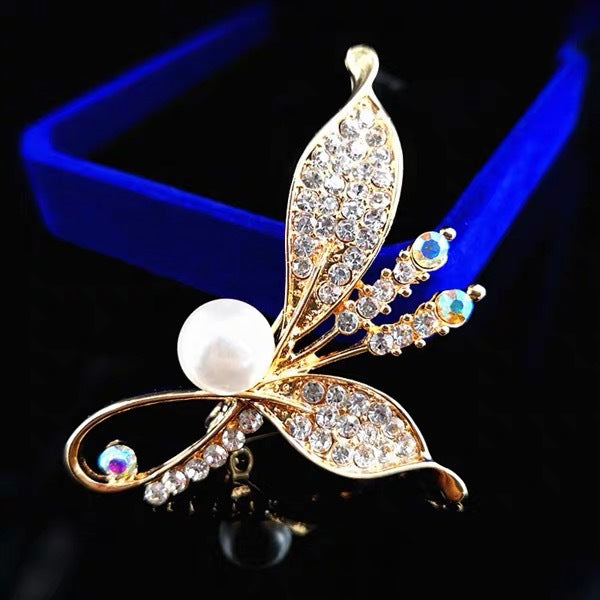Versatile brooch attached to a vibrant scarf