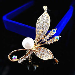 Versatile brooch attached to a vibrant scarf